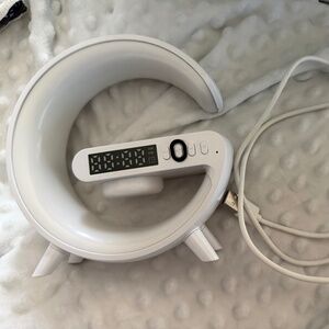 Alarm clock and charging station